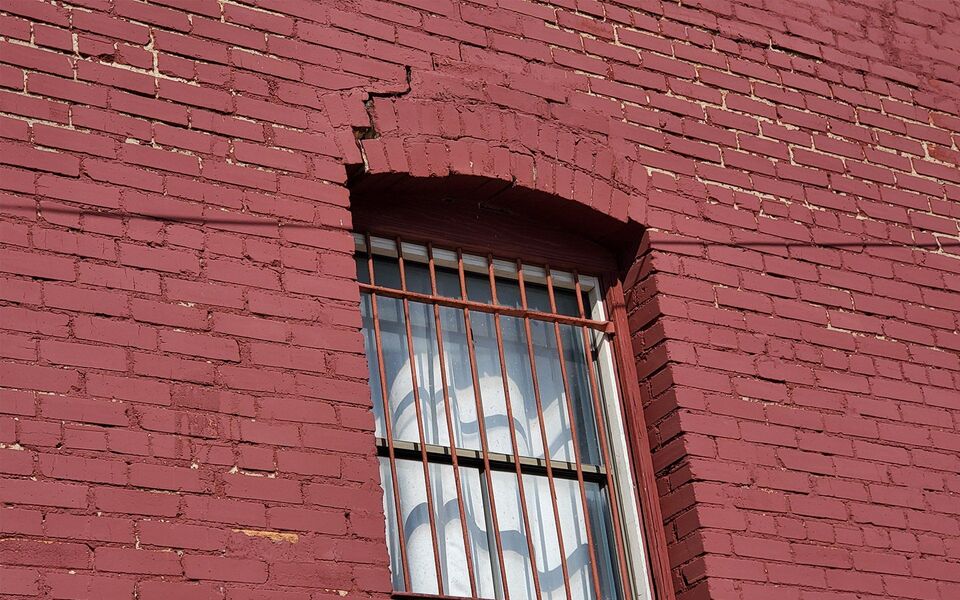 Crack over a brick lintel on an older commercial building