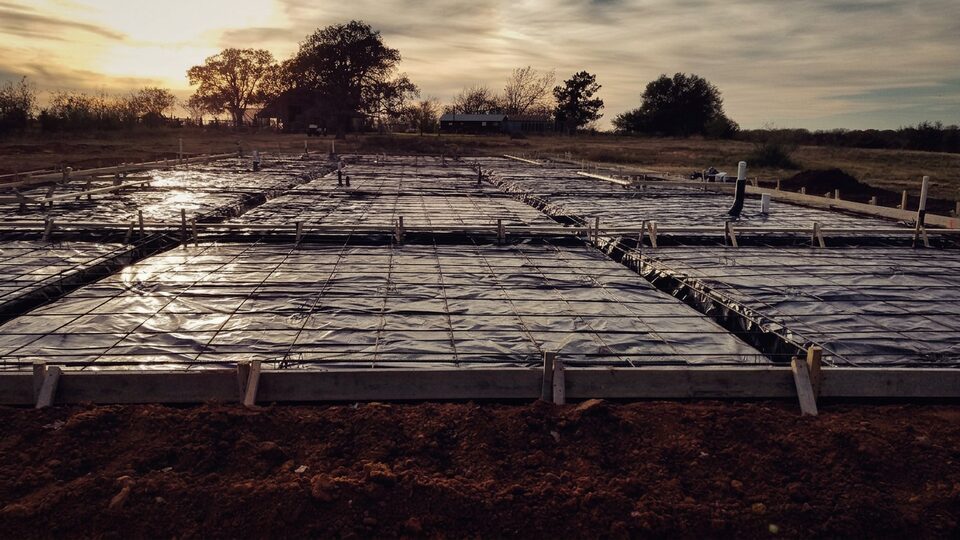 Engineered slab preparation with rebar grid at sunset
