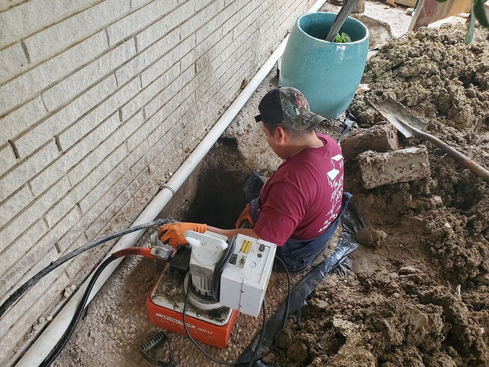 Pressing a concrete pier beneath a settled Central Texas slab