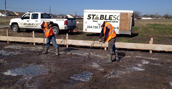 StableSoil crew treating a building pad before the slab pour