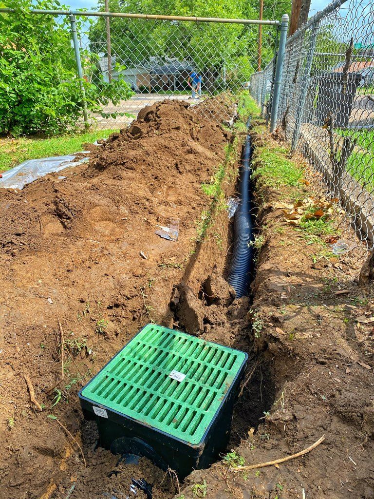 Drainage basin installation channeling water to a collection point